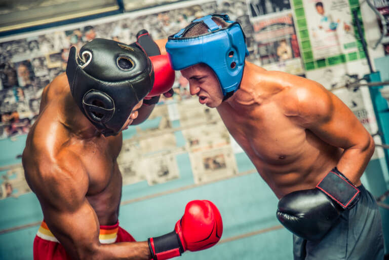 two-boxers-sparring-on-the-ring-athletes-training-ROOQ-boxing